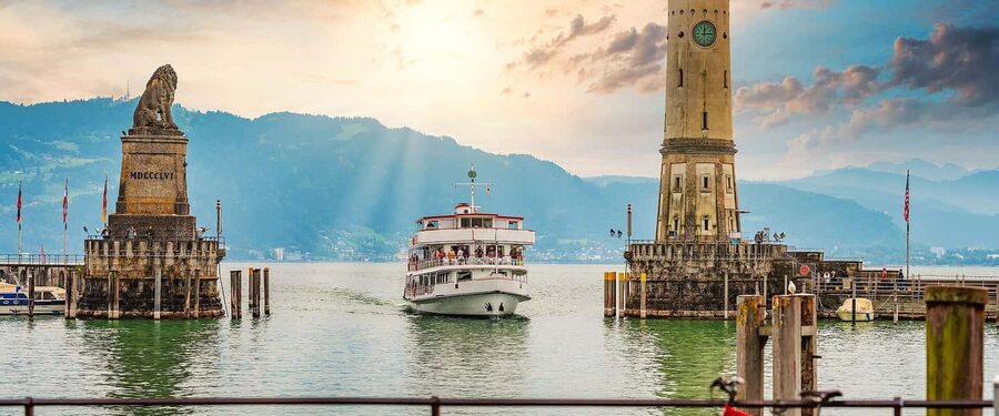 Explore 4 Countries in a Day: Liechtenstein,Austria&Germany - Lindau, Germany: medieval streets, white lighthouse, and the Bavarian Lion