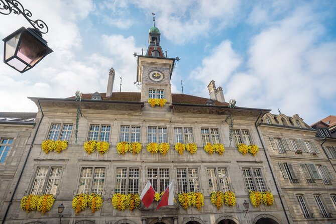 Explore Lausanne in 60 minutes with a Local - Place de la Palud and the town hall clock animation
