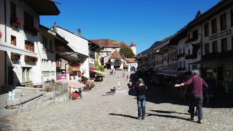 From Geneva: Gruyères Tour with Cheese & Chocolate Factories - Gruyères village hour: castles, boutiques, and cowbells