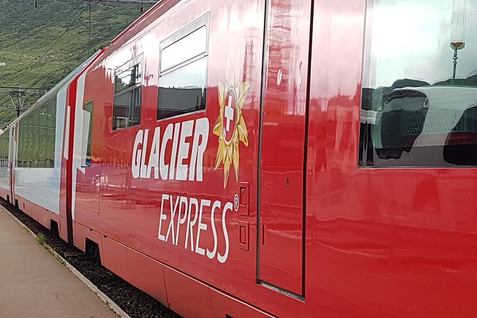 Glacier Express Panoramic Train Round Trip in one Day Private Tour from Basel - Andermatt stop time: quick photos, ski-area look, and mountain bridges