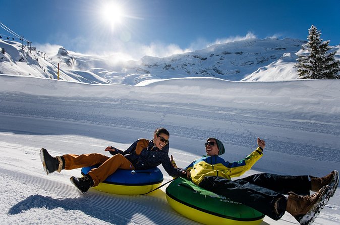 Mount Titlis Snowmobile Adventure Day Trip From Zurich - Glacier Park snowtubing and optional ice cave fun