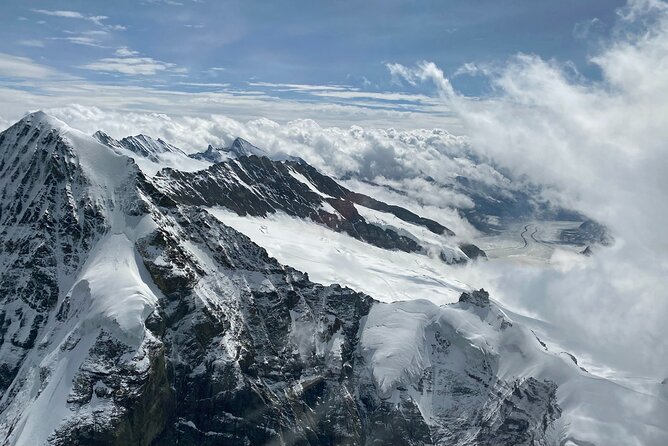 Private Swiss Alps helicopter tour over snow covered mountain peaks and glaciers - Lake Brienz: icy water, steep walls, and the big overview