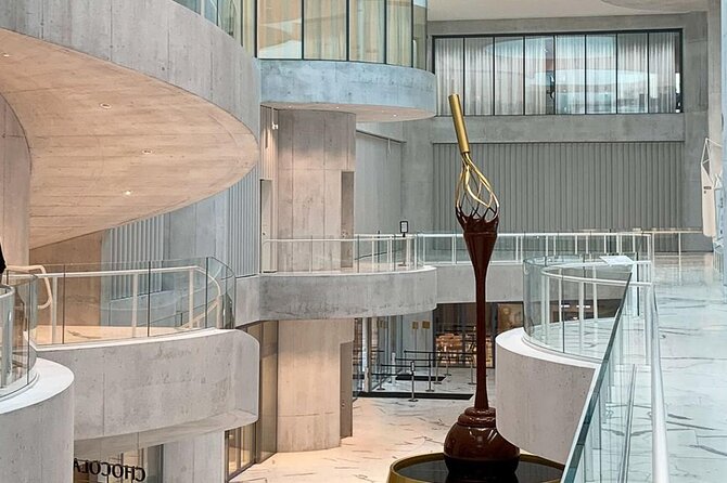 Tour in Lindt Home of Chocolate Museum From Zurich With pickup - Inside the museum: the 9-meter fountain and your audio guide