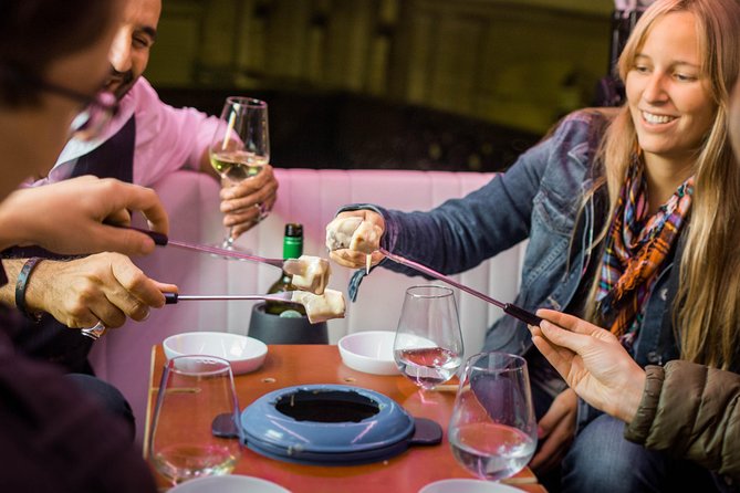 Zurich eTukTuk Private Tour - with Cheese Fondue and Wine - Bahnhofstrasse and the Shopping Street Glow