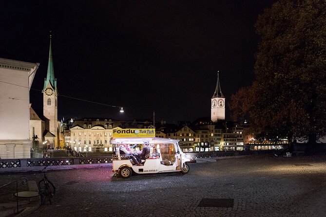 Zurich eTukTuk Private Tour - with Cheese Fondue and Wine - Grossmünster Twin Towers, Old Town Energy Without the Hustle
