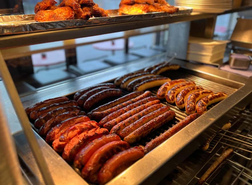 Zurich: Food Tour of 8+ Tastings with Cheeses & Chocolates - The sausage shop ritual: Leberkäse with sauerkraut and punchy mustard
