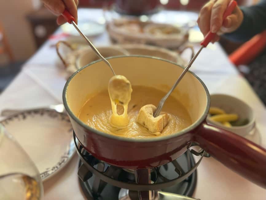 Zurich: Food Tour of 8+ Tastings with Cheeses & Chocolates - Fondue bites dipped in Kirsch, plus a bottle-shop moment for gin and whiskey