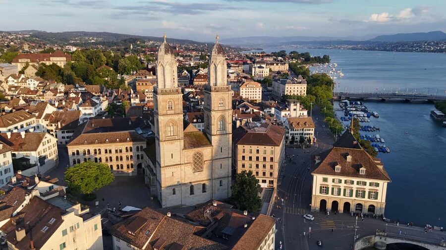 Zurich: Private City Walking Tour with Polybahn Ride - Grossmünster photo stop, a landmark moment that does not drag